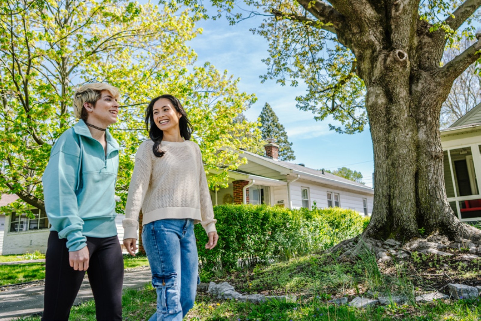 Young homeowners walking in their neighborhood